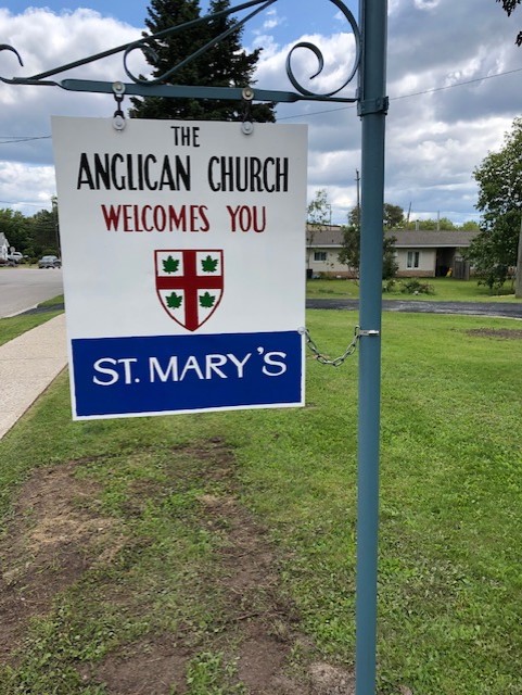 A photo of a church sign which reads "The Anglican Church Welcome's You. St. Mary's"